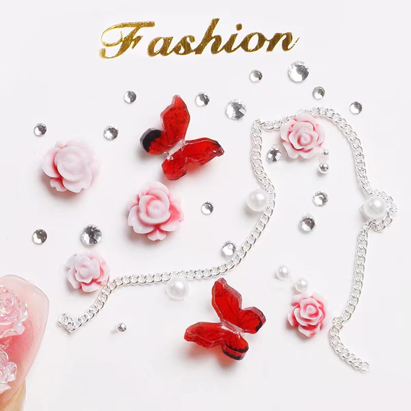 Manicure camellia material paquete de joyería pequeño libro rojo explosión arco mezcla de cadena de joyería de uñas accesorios al por mayor