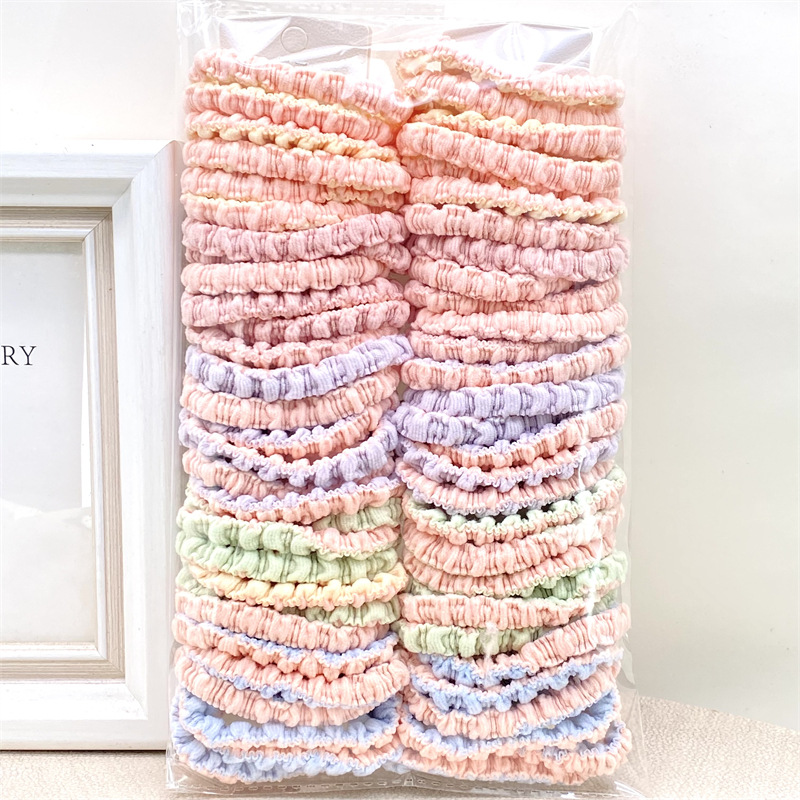Nueva cinta para el pelo estilo coreano con lazo y cuentas en color té con leche, bandas para el pelo de colores primaverales para tiendas físicas, supermercados y venta al por mayor en tiendas de 2 yuanes.