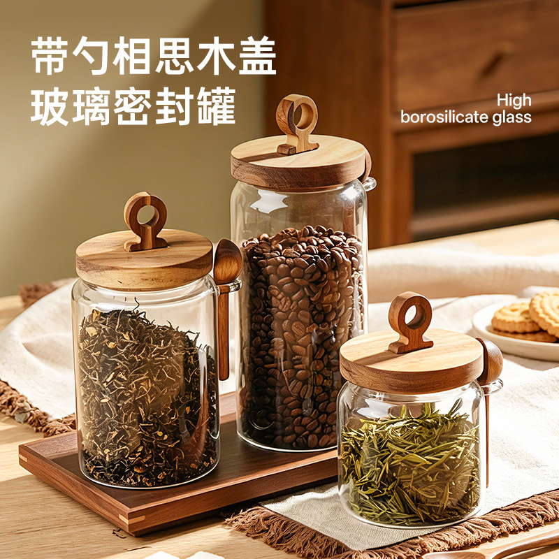 High borosilicate glass jar with wooden lid and spoon for kitchen grain storage, tea, coffee, and snack storage