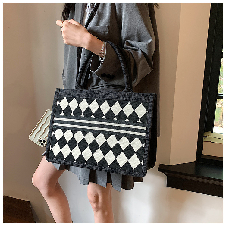 Blanco y Negro tablero de gran capacidad bolso de mano portátil 2023 nueva moda simple trabajo bolso de hombro