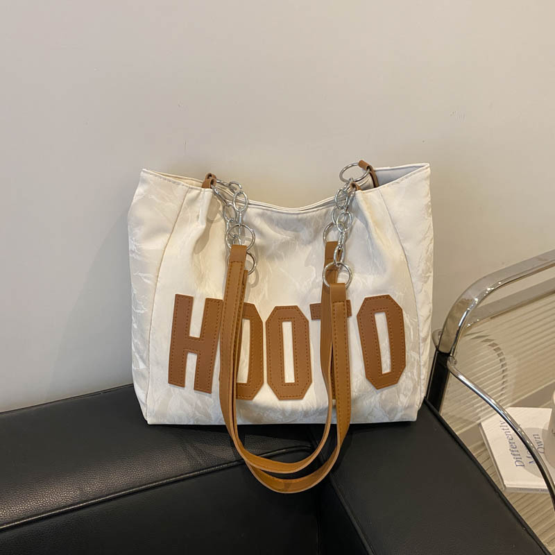 Bolsos casuales de gran capacidad para viajeros para damas 2024 nuevo estilo estilo occidental bolso de hombro todo fósforo bolso portátil de alta gama