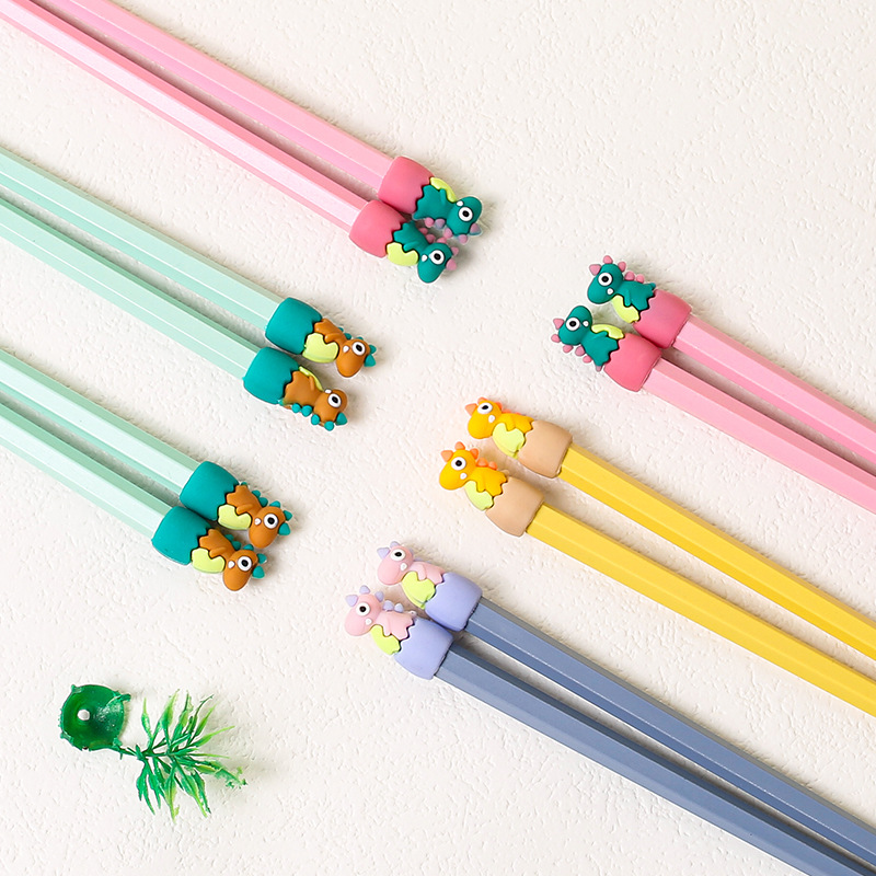 Lindos palillos de aleación de dibujos animados al por mayor Macarons de alto valor cabeza de dinosaurio comida separada una persona palillos al por mayor