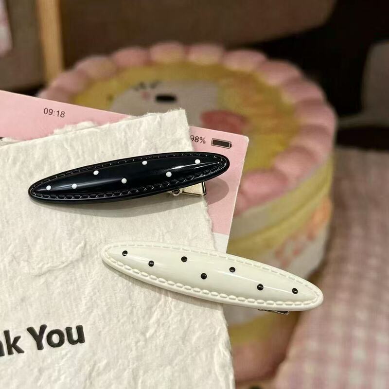 Korean-style minimalist hair clip for women, elegant and exquisite, side clip for bangs, forehead hairpin, black oval with white polka dots Korean-style minimalist hair clip for women, elegant and exquisite, side clip for bangs, forehead hairpin, black oval with white polka dots