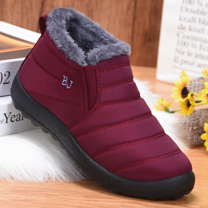Botas de algodón 2025 invierno nueva exportación zapatos de algodón botas de nieve para parejas femeninas casual forro polar cálido transfronterizo zapatos de mujer de gran tamaño