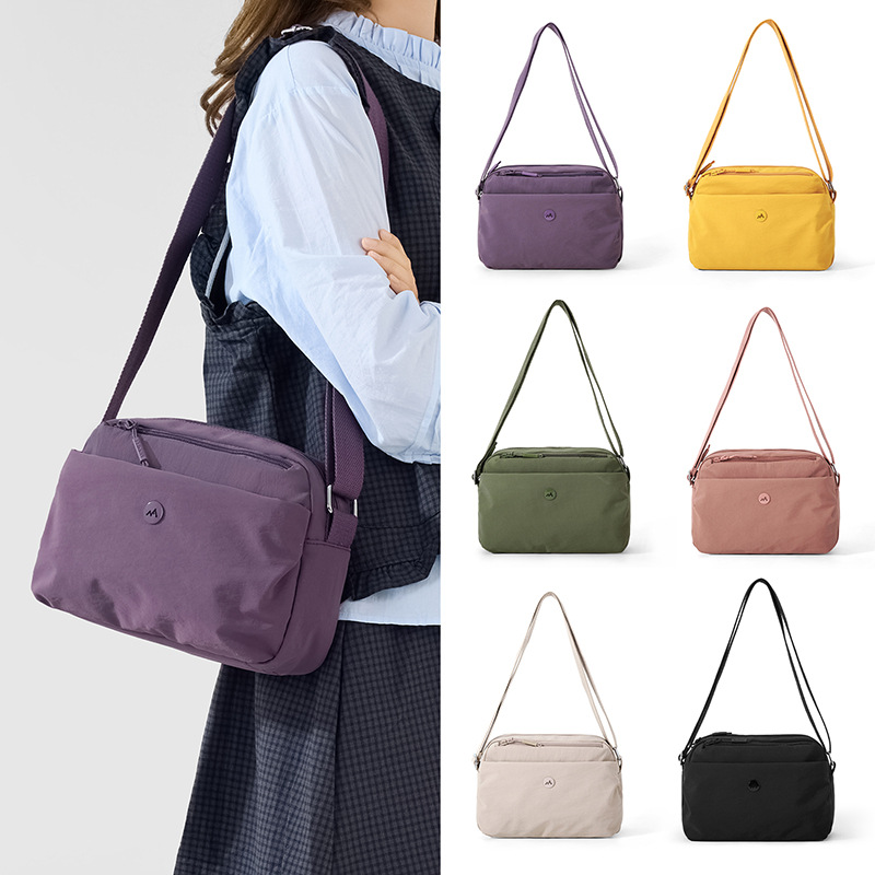2026 primavera nueva simple bolso de tela de nylon versátil bolso de mochila de comercio exterior transfronterizo bolso de hombro de mujer ligero multicapa