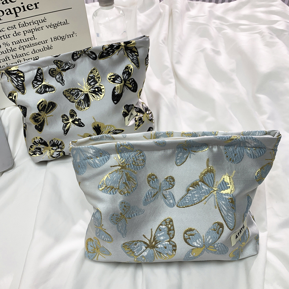 Bolsa de maquillaje de mariposa transfronteriza, bolsa de almacenamiento portátil para productos de cuidado de la piel, bolsa de lavado de viaje, bolsa cuadrada, bolsa de mano