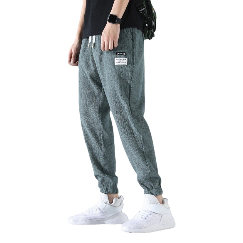 Pantalones casuales de seda de hielo para hombres recortada pantalones de hombre verano Delgado estilo de Hong Kong deportes de moda sueltos pantalones de verano transpirables atados al tobillo