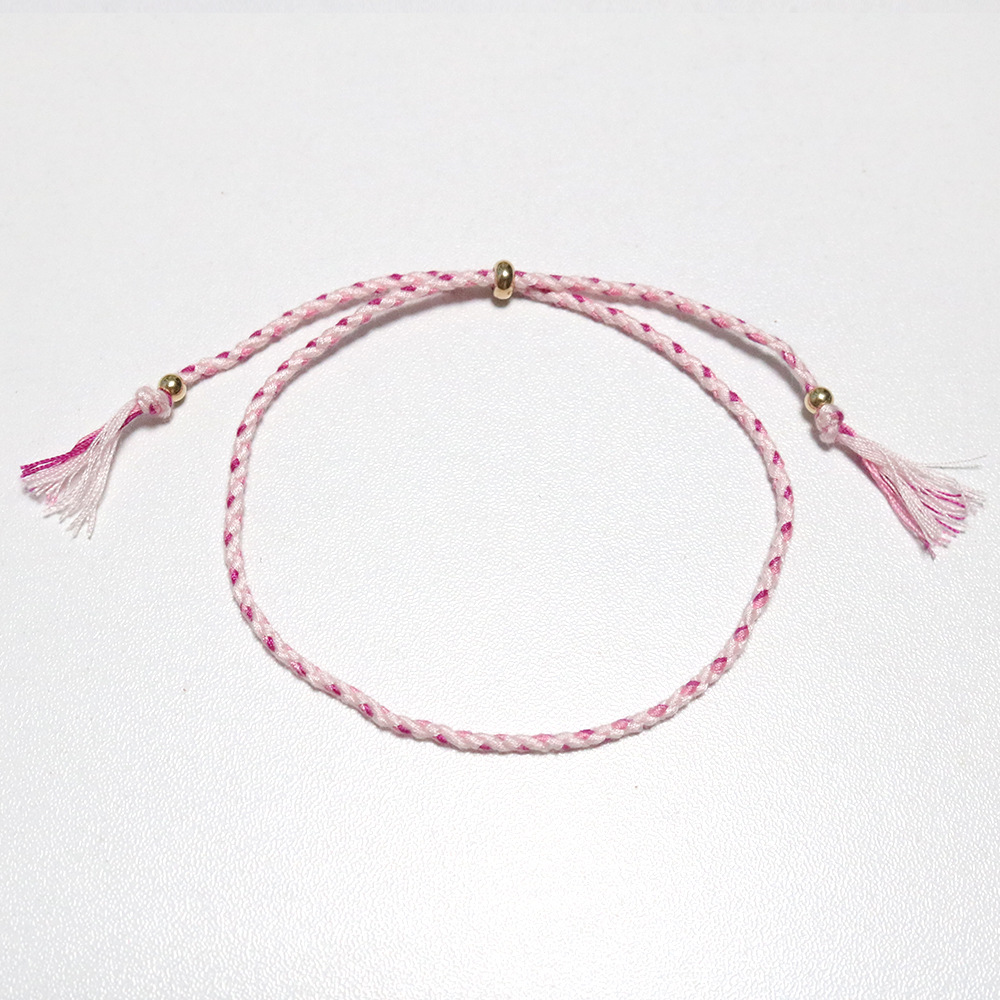 Amazon popular colorido cuerda de algodón amistad pulsera perlas de cobre borla pulsera tejida a mano ajustable hombres y mujeres pulsera