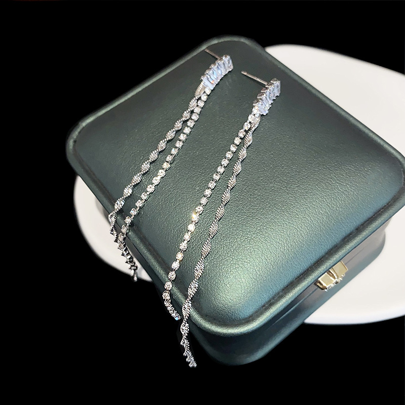 Elegant long earrings with zircon with tassels
