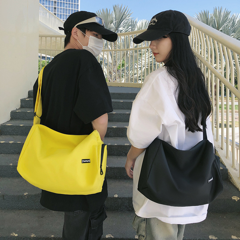 Capacious universal shoulder bag for leisure for men and women