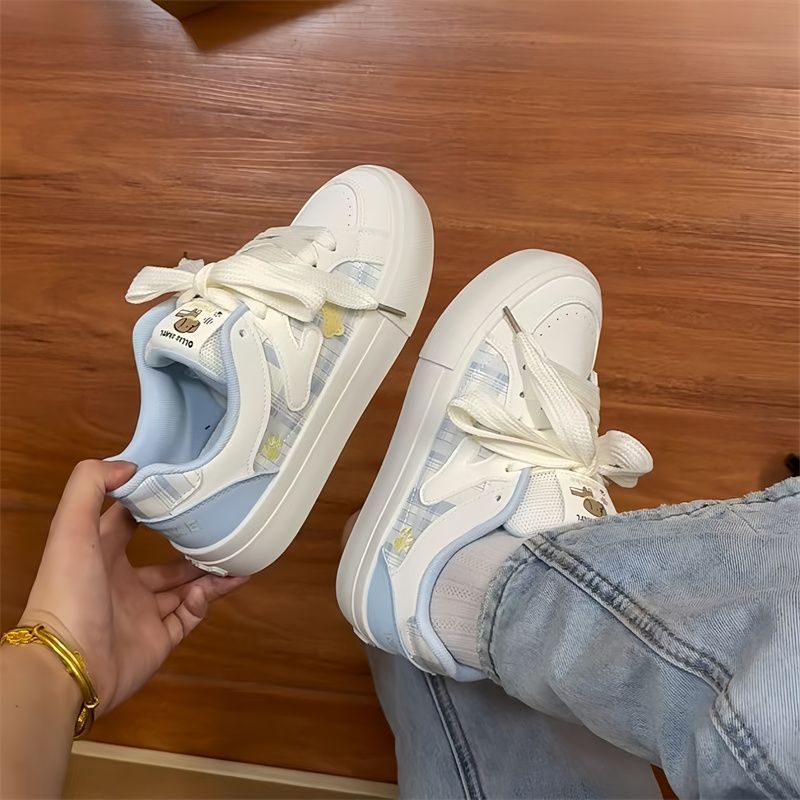 Arco de nicho coreano lindo zapatos blancos para mujeres 2025 primavera y otoño nuevo estilo de moda pareja zapatos de pan deportivo