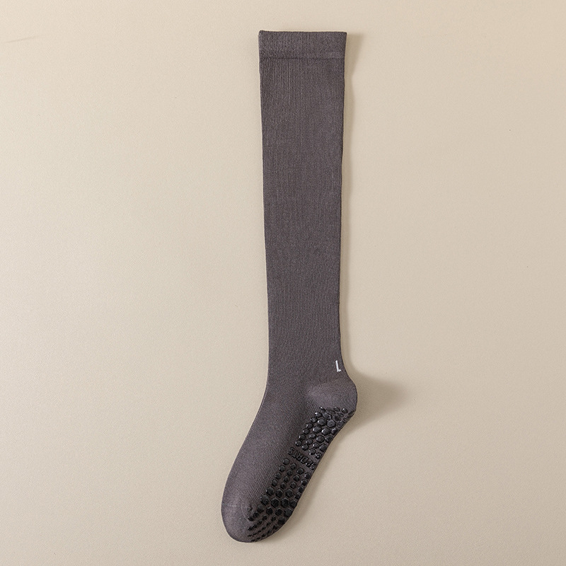 圧力の靴下の子供のヨガの靴下の高い筒の綿の純色のふくらはぎの靴下の卸売りのフィットネスのダンスの滑り止めのプラティのストッキング