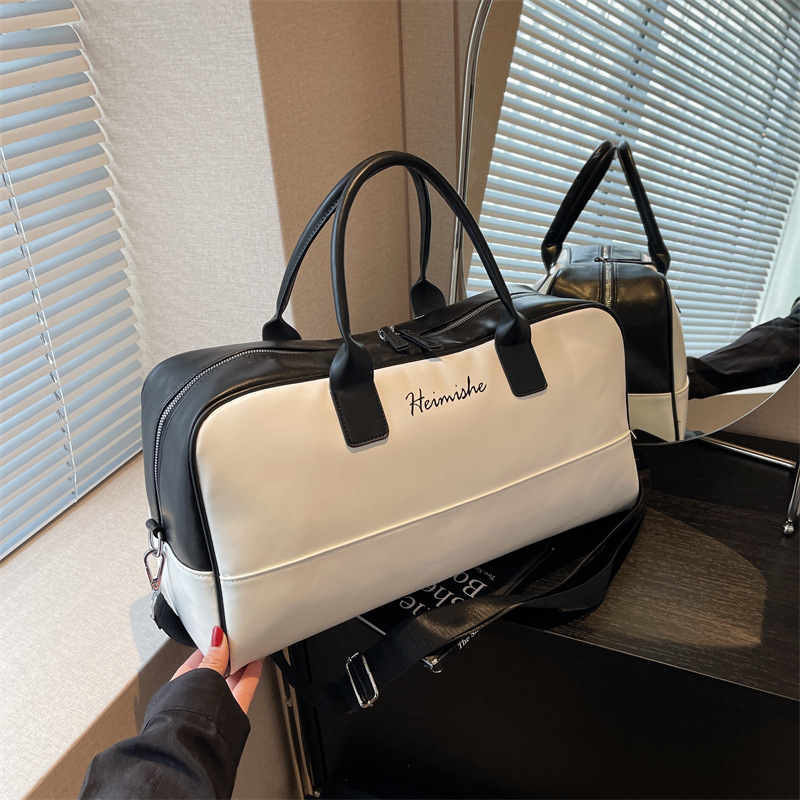 Bolsa de equipaje de gran capacidad de viaje de negocios de corta distancia Nueva bolsa de viaje de color de contraste de moda bolsa de almacenamiento de ropa portátil simple de un hombro