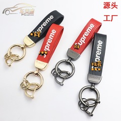 爆発的なブランドの金属皮革自動車のキーホルダーのキーホルダーの個性は腰式の創意の美しい贈り物のペンダントを掛けます。