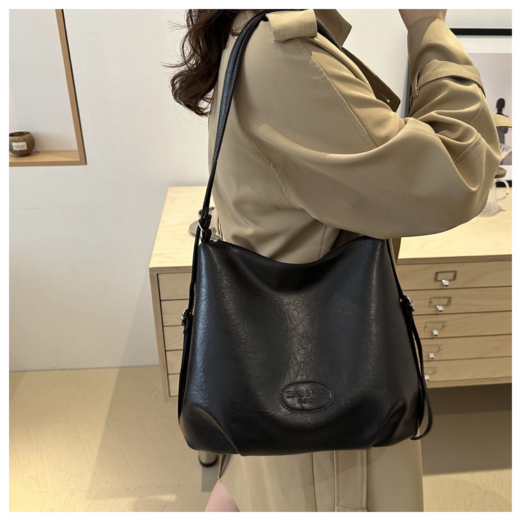 The 2024 new pleated tote bag is a large-capacity casual and fashionable backpack for women, featuring multi-functional texture and a single-shoulder crossbody bag undefined