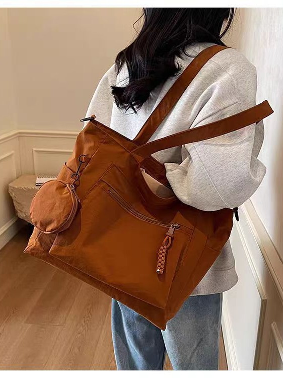 Transfronterizos casuales de color sólido nylon bolso de mano nueva bolsa de tela de transporte de gran capacidad simple y ligera mochila de hombro