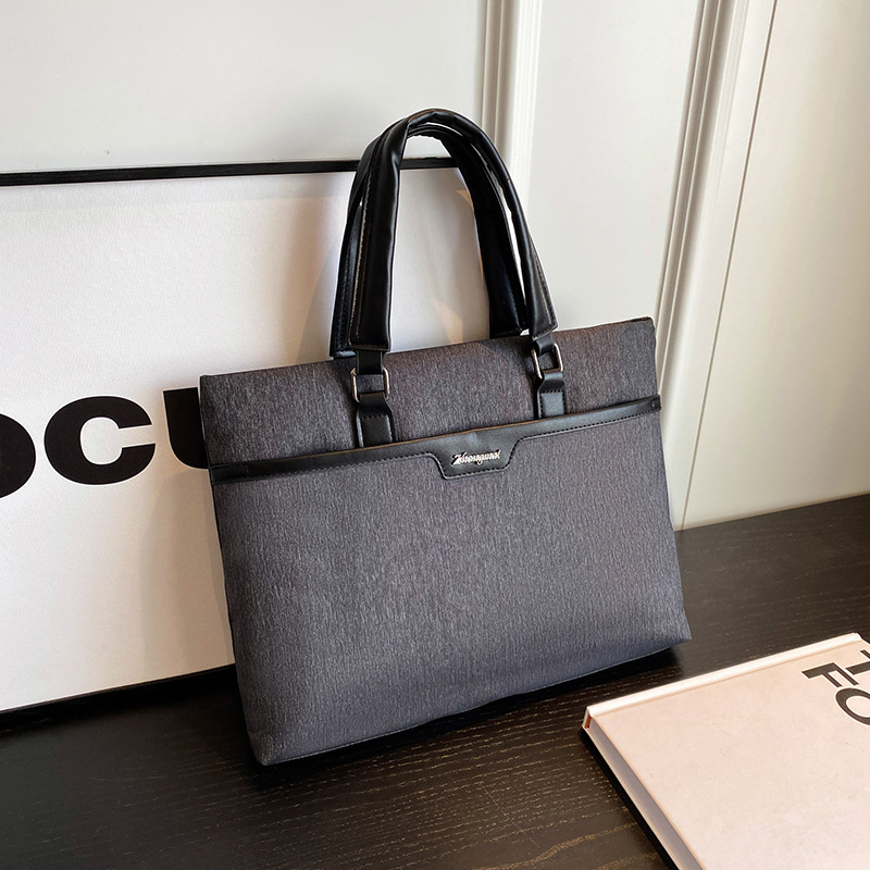 工廠批發印刷logo防水加寬會議手提包豎版帶網兜公文包夾棉電腦包