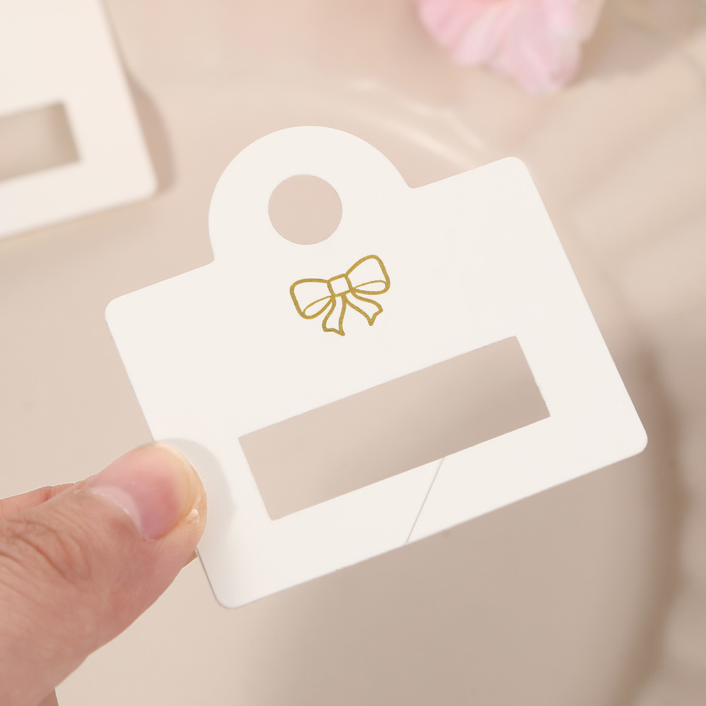 Nuevo clip de tiburón pegatinas de PVC agarrar agujero tarjeta clip para el cabello adornamiento de cabello exhibición colgante cartón de embalaje universal