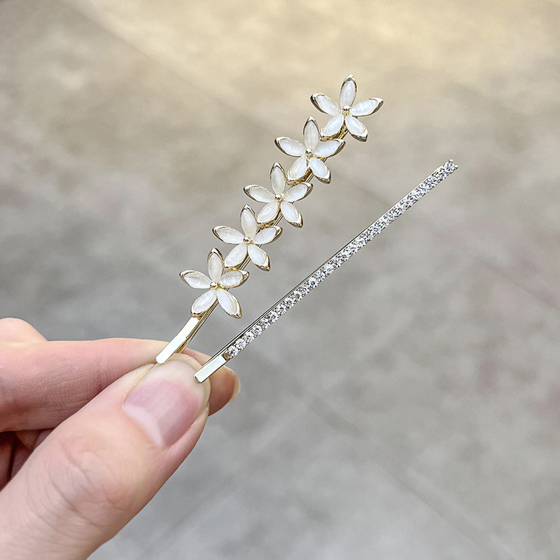 New Korean product cat's eye stone flower hair clip, stylish and elegant hairpin for girls, suitable for bangs, top, and side use