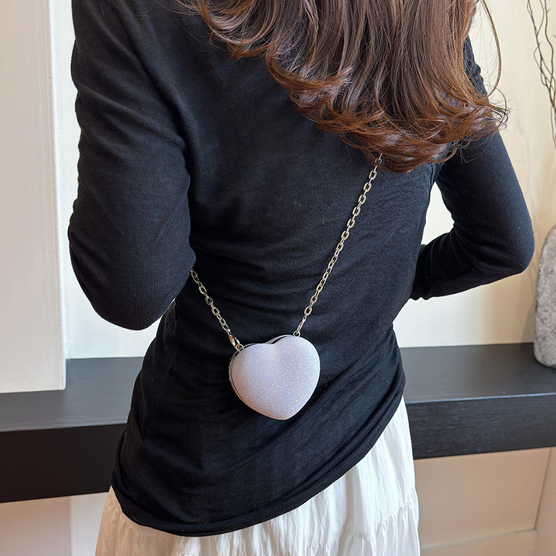 Pequeño viento japonés de fragancia personalidad de color caramelo de corazón de melocotón mini auriculares para mujeres bolsas de 24 verano nuevo hombro mochila