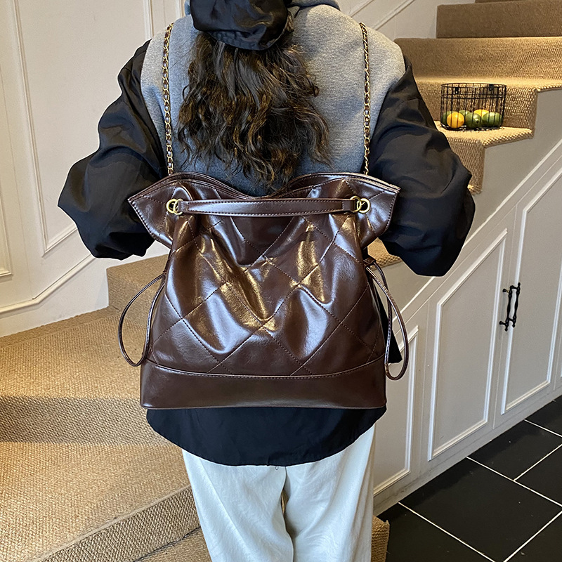 Bolsa de hombro de viaje coreano, cadena de cuadrícula, bolsa de tote universal para mujeres 2025, nueva mochila casual de tres usos