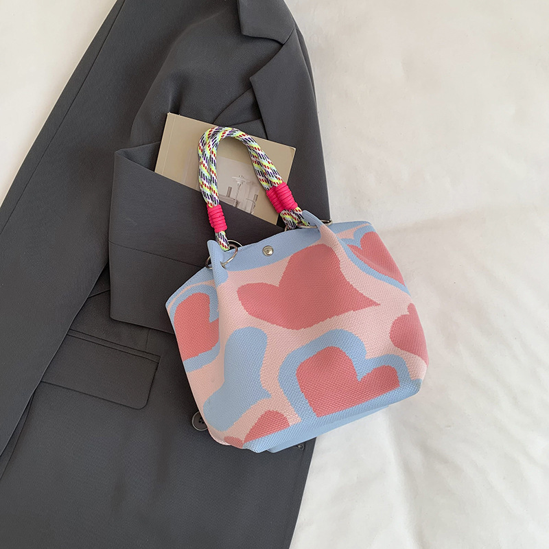 Bolsa de impresión coreana de niña nicho bolso de cubo de diseño diario versátil bolso de mano para estudiantes de viaje diario