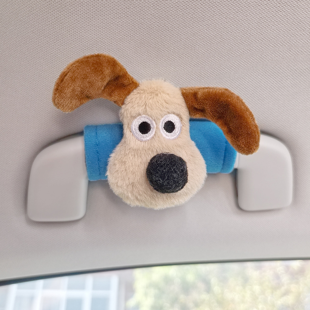 Perro de peluche maneja de automóvil maneja de automóvil masculino y femenino maneja de puerta interior cubierta guante de techo
