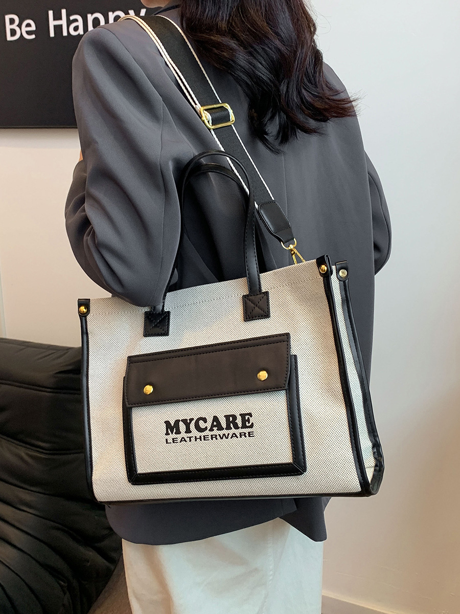 Bolso de lona de gran capacidad para mujeres 2024 nueva moda color contrastante empalme mochila de hombro simple bolsa de mano casual