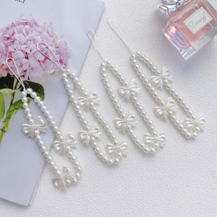 Factory direct supply of rice -white pearl bow mobile phone case hanging chain ear plug shells hanging chain bracelet accessories wholesale