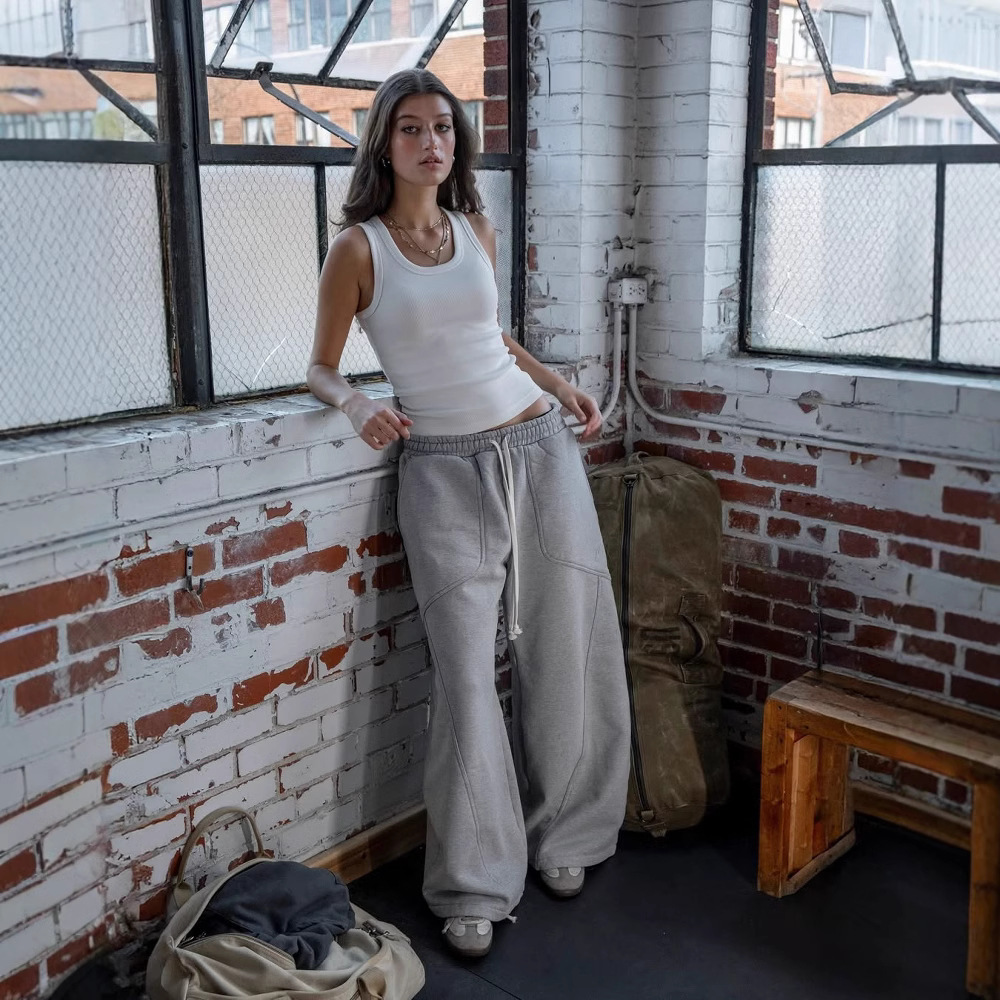Spot 2025 Cross-border color sólido casual tendencia calle alta pierna ancha personalidad larga calle suelta hombres y mujeres pantalones de guardia del mismo estilo