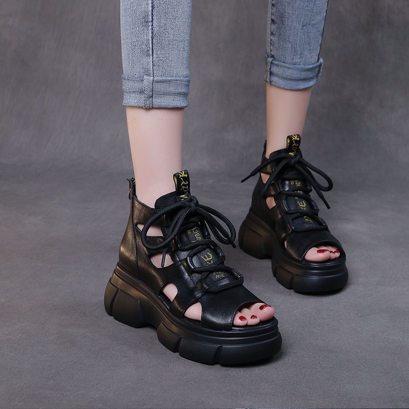 Sandalias de cuero suave retro hueco de soleas gruesas de verano 2024 muffin fondo de tacones de pez boca de lazos sandalias de soleas planas mujeres