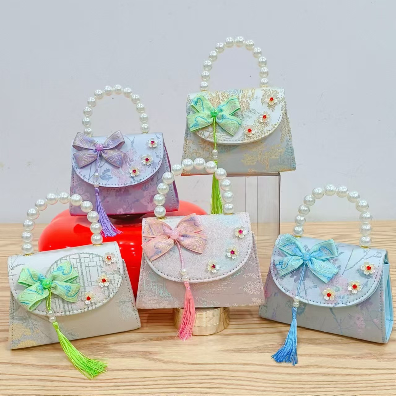 Bolsas de niños arco de estilo chino bordilla accesorios de niñas bolsas de mano princesa de perlas bolsa de cambio