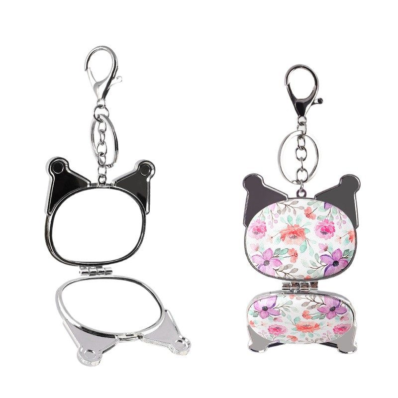 Suministro directo de fábrica de una variedad de formas, bolsa colgante, espejo de princesa, espejo de cuero de impresión de doble cara, espejo plegable, bolsa colgante, llavero de espejo