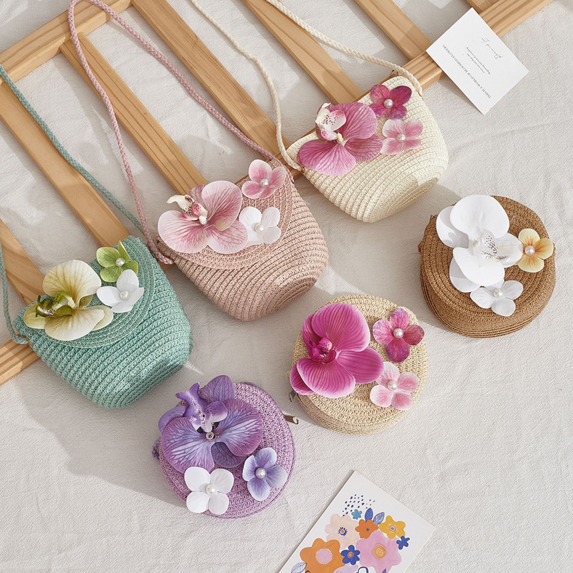 Spring and summer orchid straw woven bag for girls, children's woven bag for outdoor outings, small shoulder bag, coin purse, phone bag