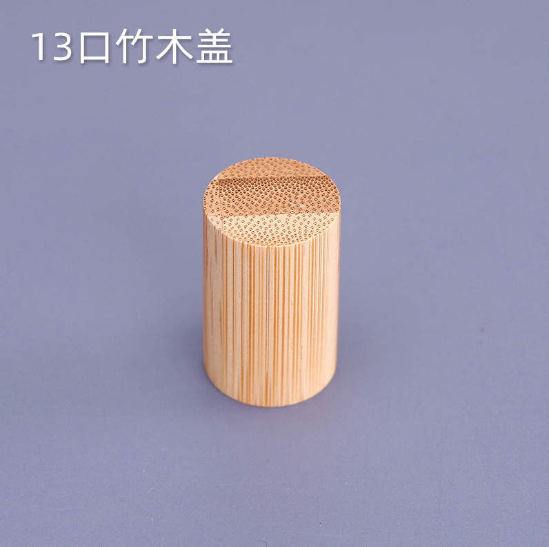 Venta al por mayor directa de fábrica en stock bayoneta botella de perfume cilíndrica multicolor cubierta de madera cosméticos cubierta de palo de rosa