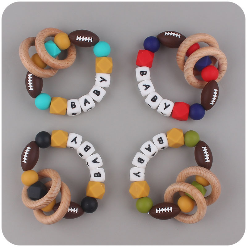 Nuevo bebé suministros de dibujos animados rugby mordedor chupete cadena calmante bebé DIY pulsera mordedor conjunto de dos piezas