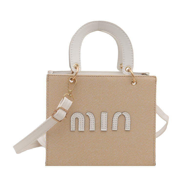 Bolso de mano de moda al por mayor color contraste bolso de mujer 2025 verano nueva letra de lujo bolso de hombro de viaje mochila