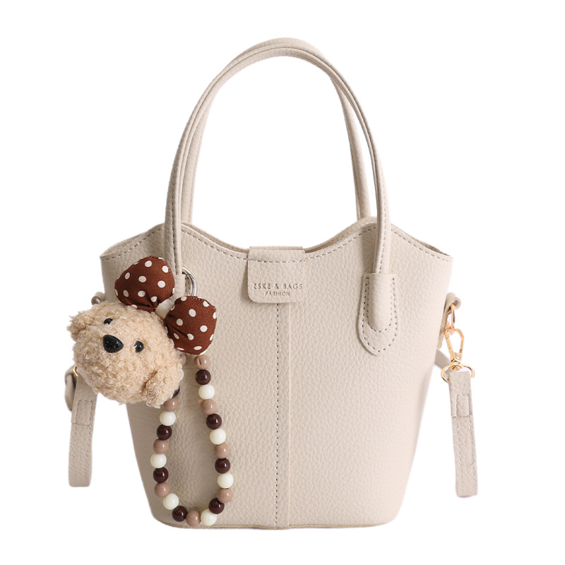 Bolso de mano de moda retro 2026 nuevo temperamento simple bolso de cubo de viaje ocio mochila de hombro