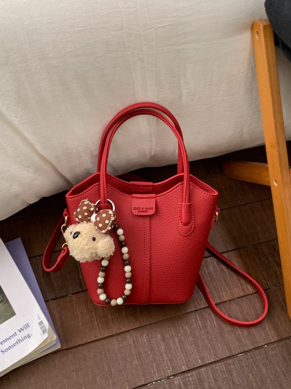 Bolso de mano de moda retro 2026 nuevo temperamento simple bolso de cubo de viaje ocio mochila de hombro