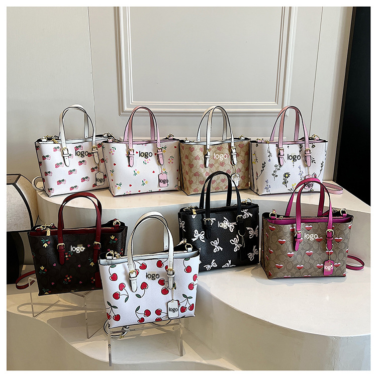 Bolsos de moda europeos y americanos transfronterizos, populares femeninos, bolsos de mensajero de un solo hombro con impresión retro de gran capacidad