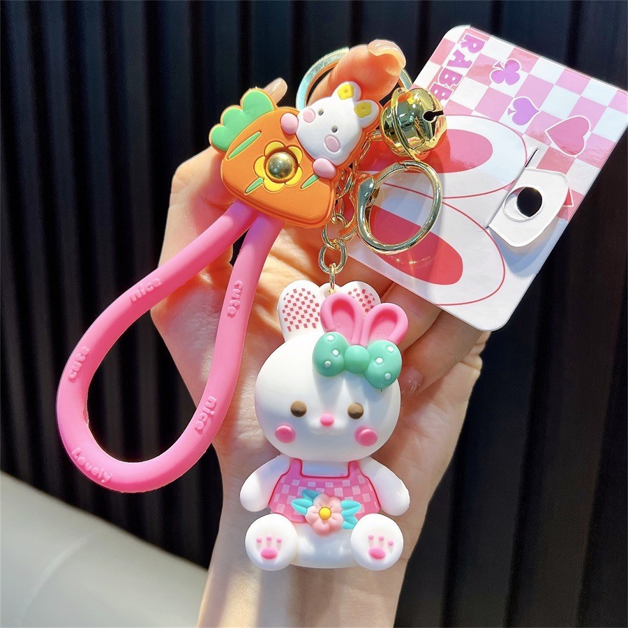 Keychain dinosaurio auténtico lindo bolso colgante de goma blanda llavero de automóvil muñeca pequeña máquina de regalos al por mayor image 12