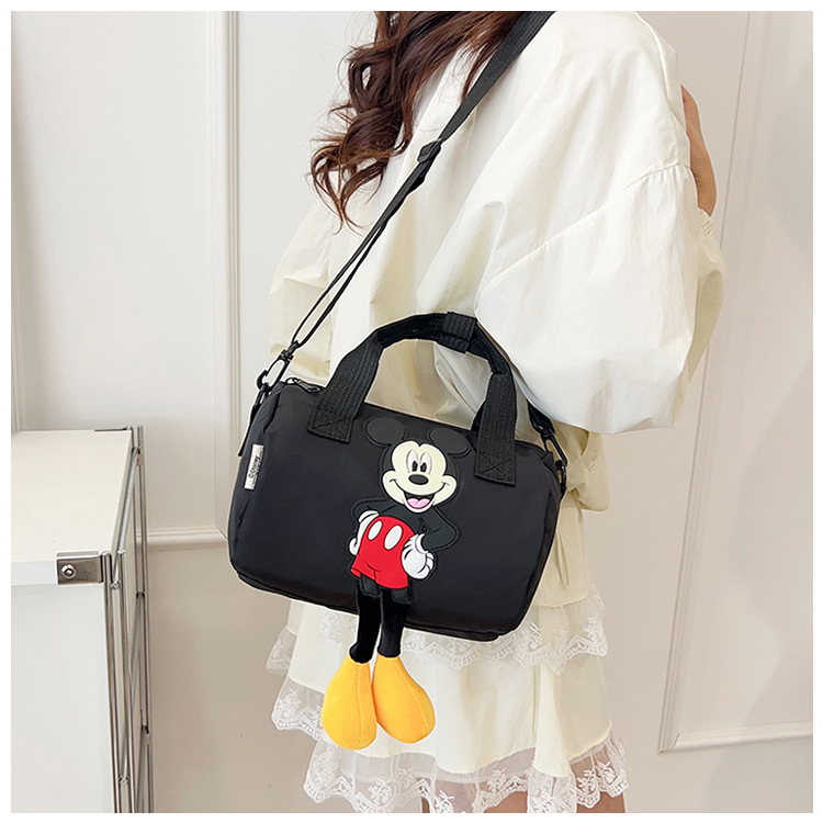 The 2021 new children's bags feature a cute Mickey Mouse pattern bowling bag for girls and a fashionable hand-held shoulder bag undefined
