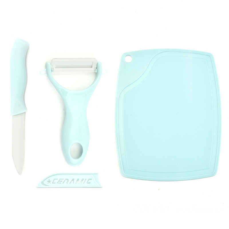 Suplemento de alimentos para bebés traje de fruta cuchillo de cerámica de tres piezas tabla de cortar melón Cepilladora cuchillo combinación de doble cara tarjeta de color de embalaje