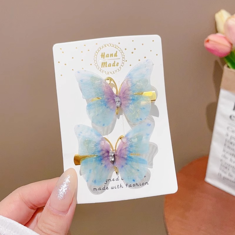 Clip de cabello de mariposa móvil ultra inmortal electrónica azul tulle perla clip de boca de pato decoración accesorios de playa clip tocado