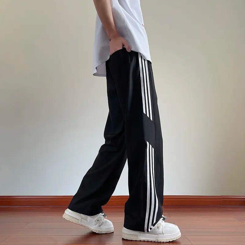 Pantalones casuales a rayas para hombres de primavera y otoño nuevos estudiantes adolescentes sueltos comercio exterior americano tres pantalones para hombres de verano