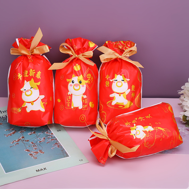 厂家直供中国风新年糖果零食抽绳束口袋卡通牛印花EVA防水防尘袋