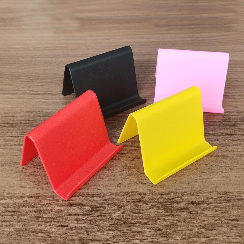 Creativo perezoso soporte de teléfono móvil de escritorio simple soporte de teléfono móvil de plástico plegable regalos al por mayor regalos se pueden imprimir LOGO