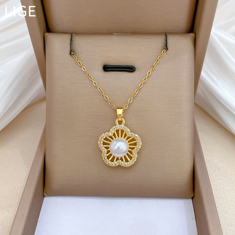 Collar y aretes de acero [Zhengzhou] conjunto de aretes de lujo ligero de diamante completo perla temperamento de banquete aretes de aretes combinación de collares