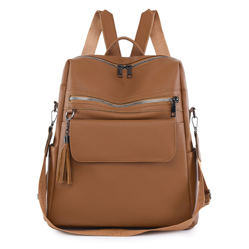 2024 nueva mochila de PU de moda casual para mujer, borla de moda, mochila de viaje de color sólido de gran capacidad al por mayor