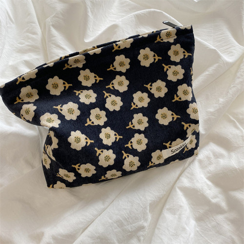 Leather embossed camellia makeup bag, portable, hand-held, women's minimalist daily coin purse, Japanese literary storage bag
